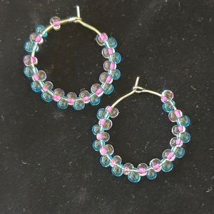 Stainless Steel earrings that are handmade with glass beads.